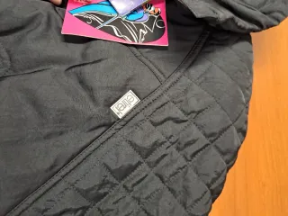 Chaqueta esquí Etirel mujer negra y naranja