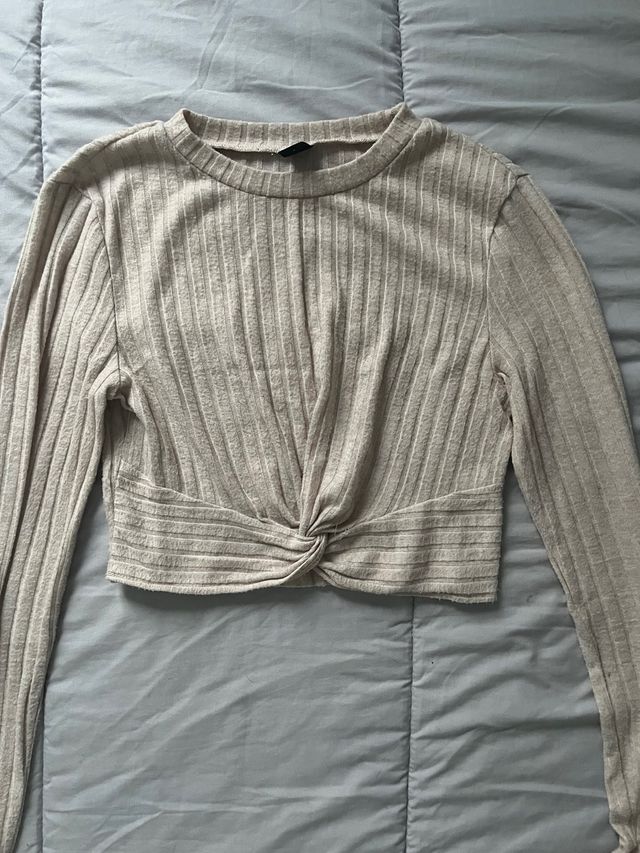 Suéter beige manga larga con nudo