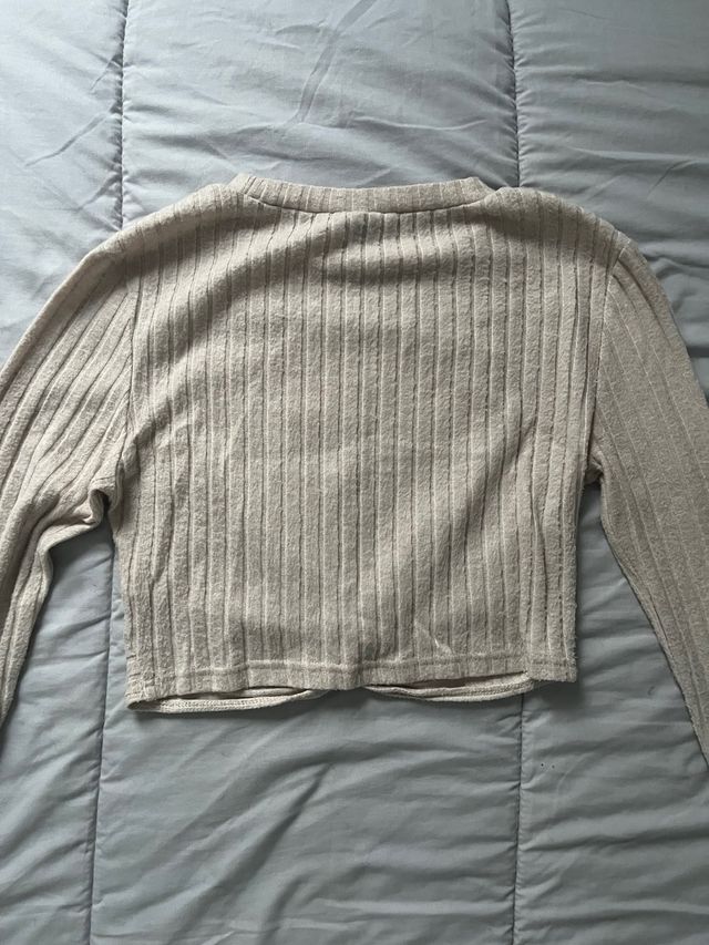 Suéter beige manga larga con nudo