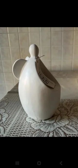 Portacandele Angelo in ceramica bianca.