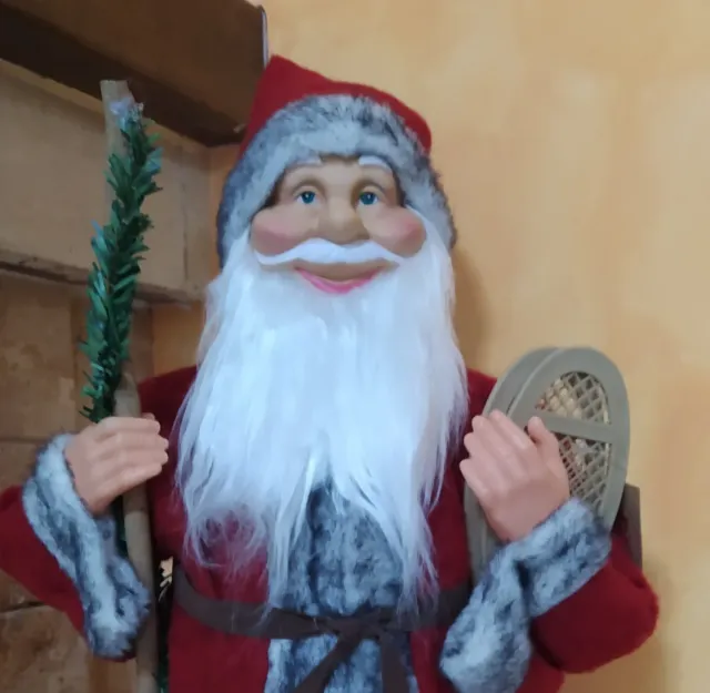 Babbo Natale con bastone e racchette