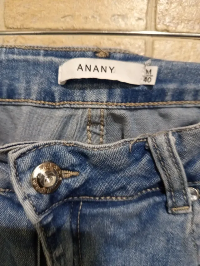 Pantalón vaquero M con bordado y flecos. Elásticos