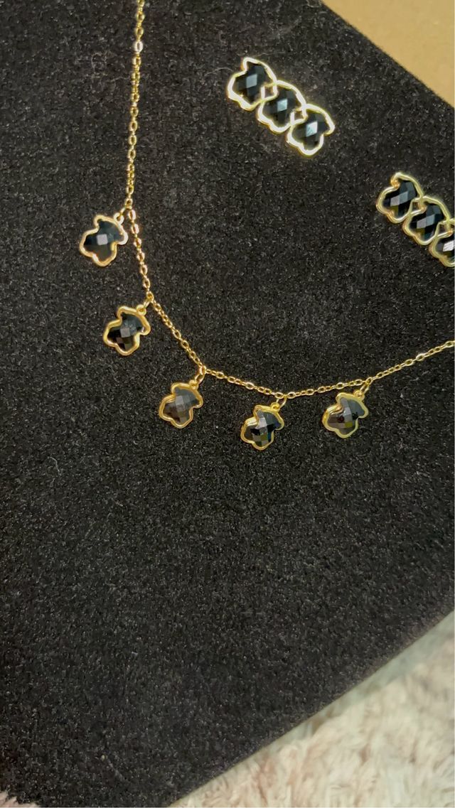 Conjunto tous dorado y negro en acero inoxidable