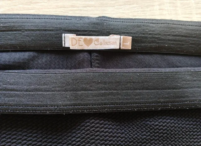 Falda lápiz elástica negra por la rodilla