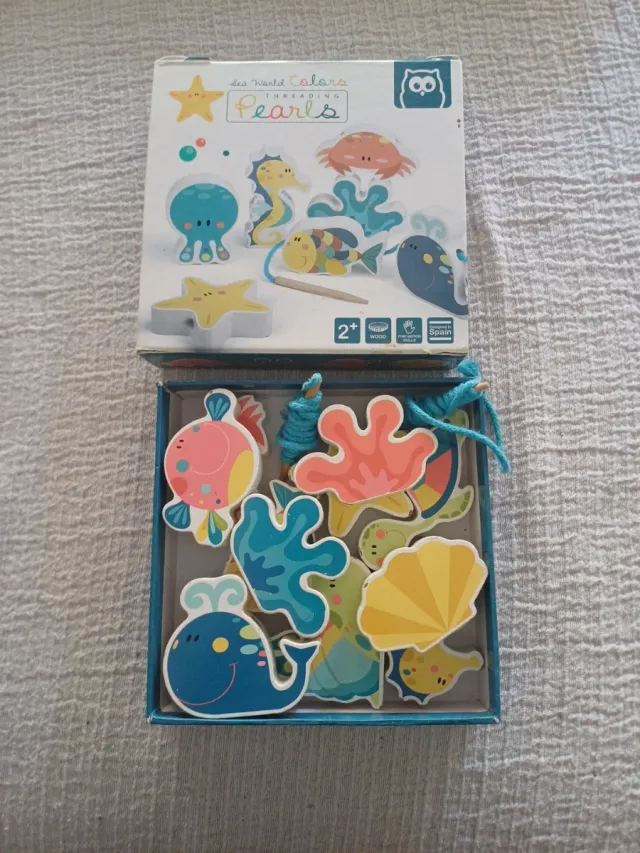 Juego de ensartar perlas marinas