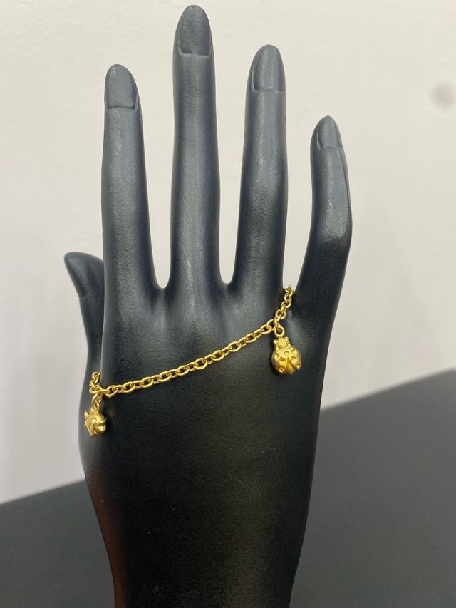 Pulsera oro 18k mariquita y pez