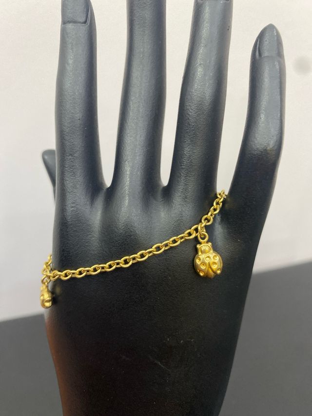 Pulsera oro 18k mariquita y pez