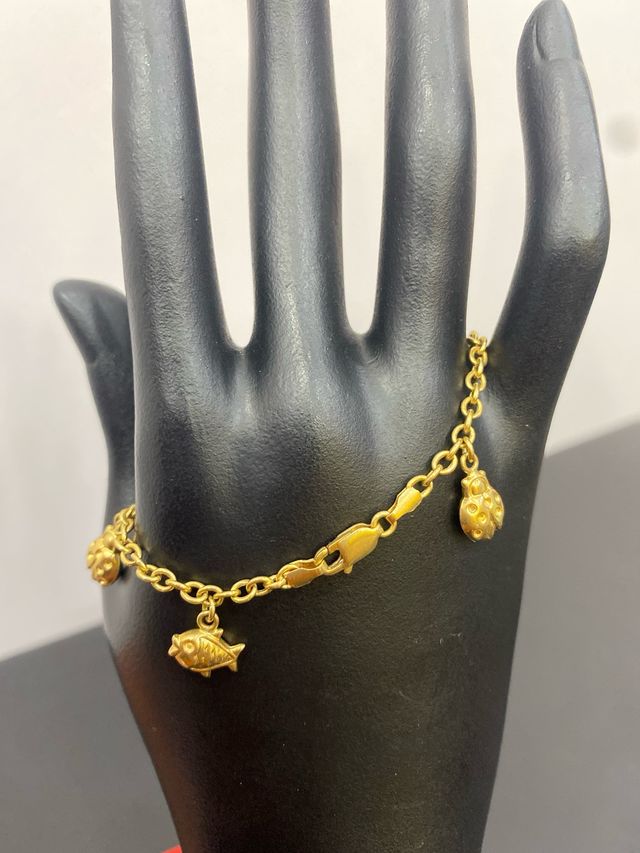 Pulsera oro 18k mariquita y pez