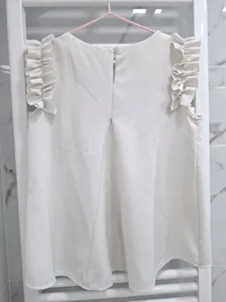 Blusa Top sin mangas blanco con volantes
