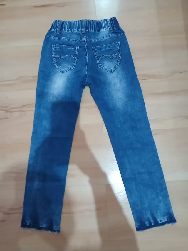 Pantalón vaquero ancho con cordón rosa