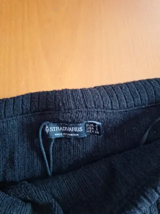 Jersey negro escotado manga larga