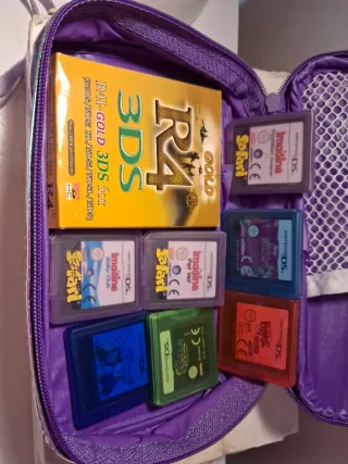 Nintendo DS Rosa con Correa y juegos