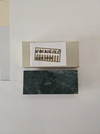 Ábaco de mármol y bronce con caja e instrucciones