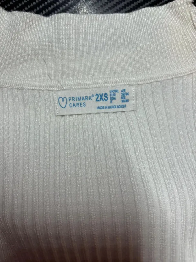 Jersey de cuello alto blanco de canalé