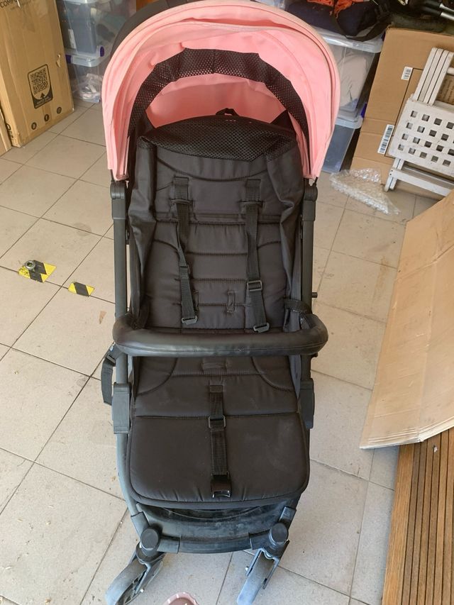 Carro de bebé rosa y negro