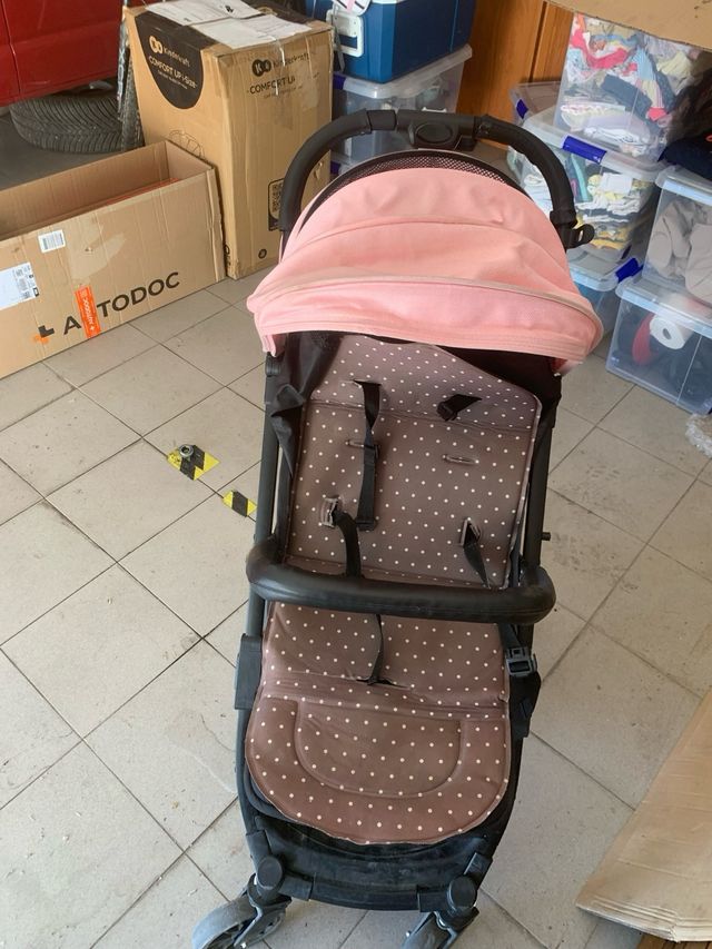 Carro de bebé rosa y negro