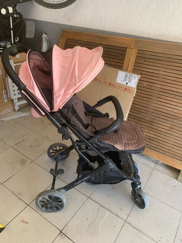 Carro de bebé rosa y negro