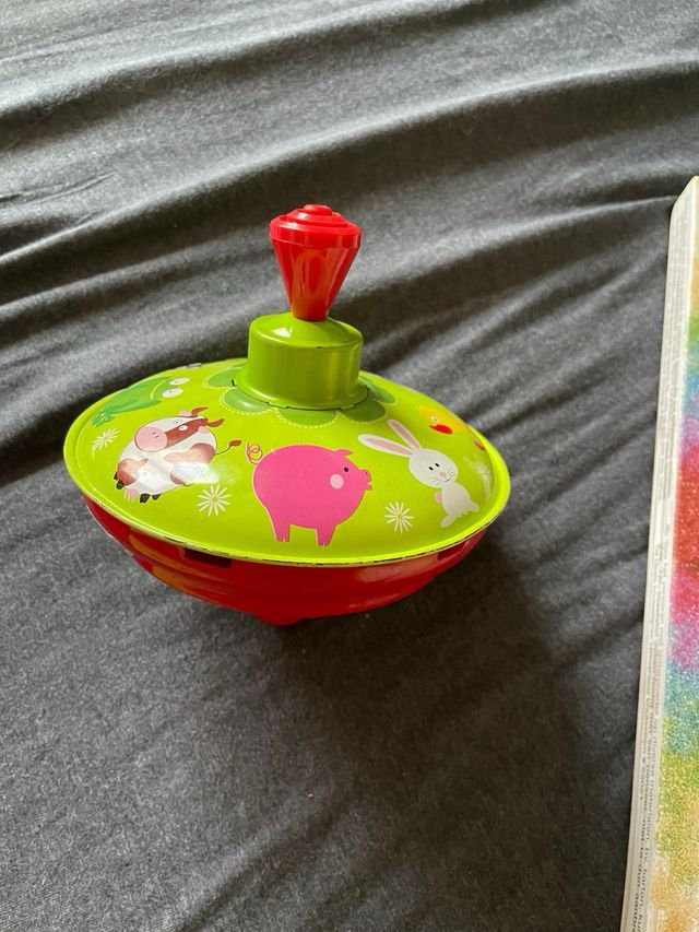 Peonza infantil de hojalata con animales