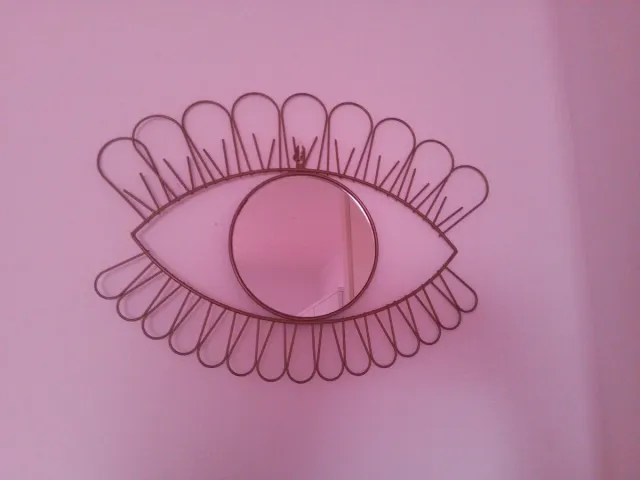 Espejo decorativo ojo dorado