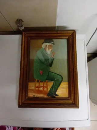 Quadro dipinto uomo seduto con cappello