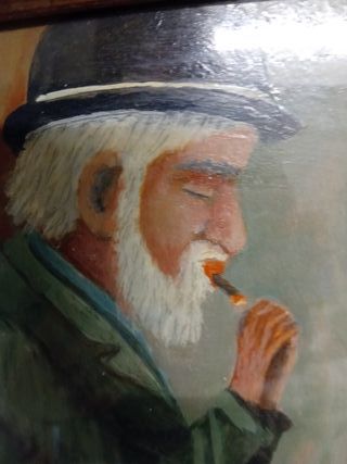 Quadro dipinto uomo seduto con cappello