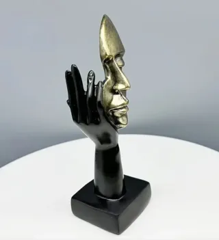 Statuetta viso astratto oro e nero