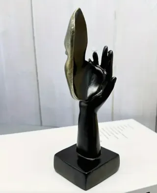 Statuetta viso astratto oro e nero