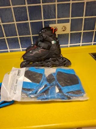 Patines Oxelo negros y protecciones