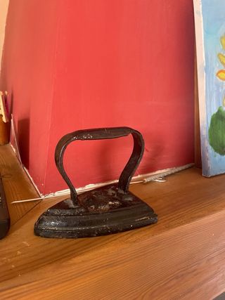 Plancha antigua de hierro fundido