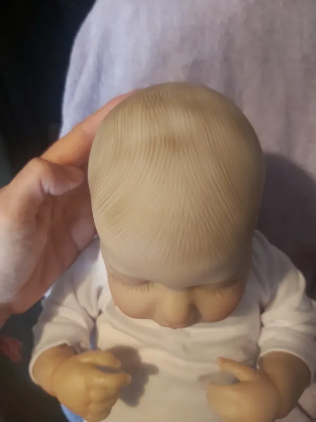 Bebé Reborn realista con chupete y biberón