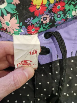 Bañador O'Neill mujer lunares negro y morado