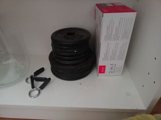 Barra y pesas para gimnasio