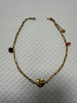 Collar cruz dorado con piedras