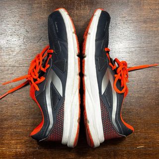 Zapatillas Kalenji Negras y Naranjas