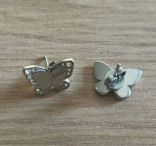 Pendientes mariposa Guess plateados