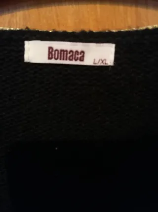 Chaqueta negra con ribete dorado