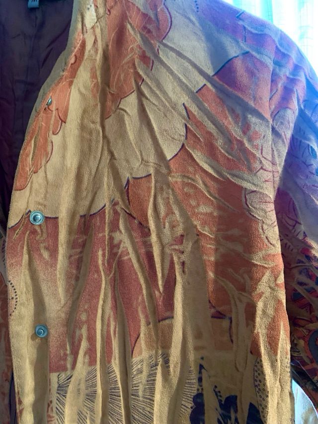 Gabardina guardapolvo, muy especial.