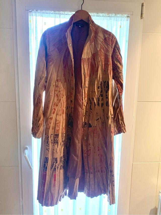 Gabardina guardapolvo, muy especial.