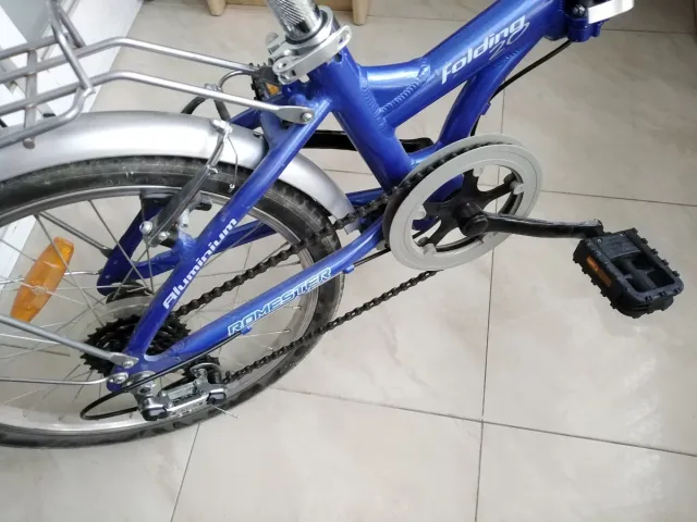 Bicicleta plegable azul, marca Romester Alloy