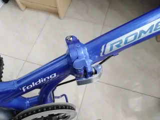 Bicicleta plegable azul, marca Romester Alloy