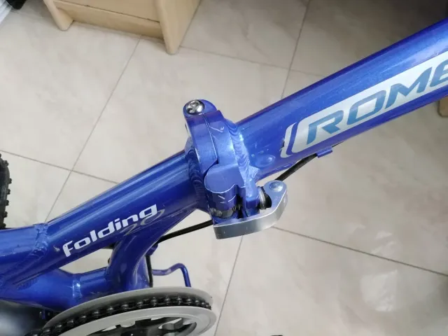 Bicicleta plegable azul, marca Romester Alloy