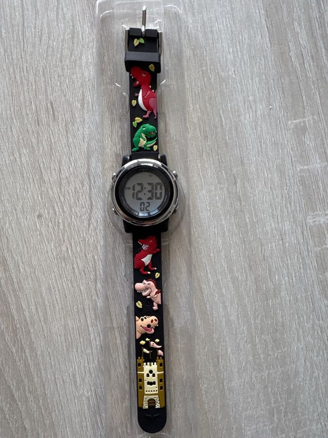 Reloj infantil digital con dibujos de dinosaurios