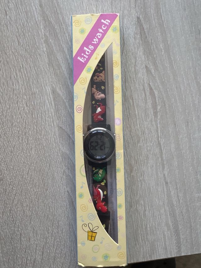 Reloj infantil digital con dibujos de dinosaurios