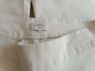 Pantalón flare beige con flecos