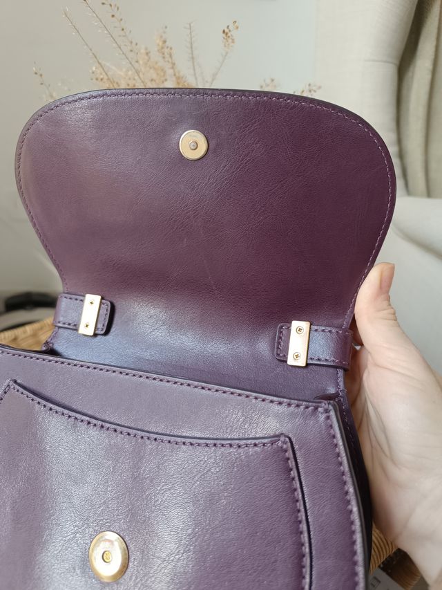 Borsetta Coccinelle viola con dettagli oro