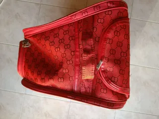 Trolley rosso fantasia monogram / ruote e manico