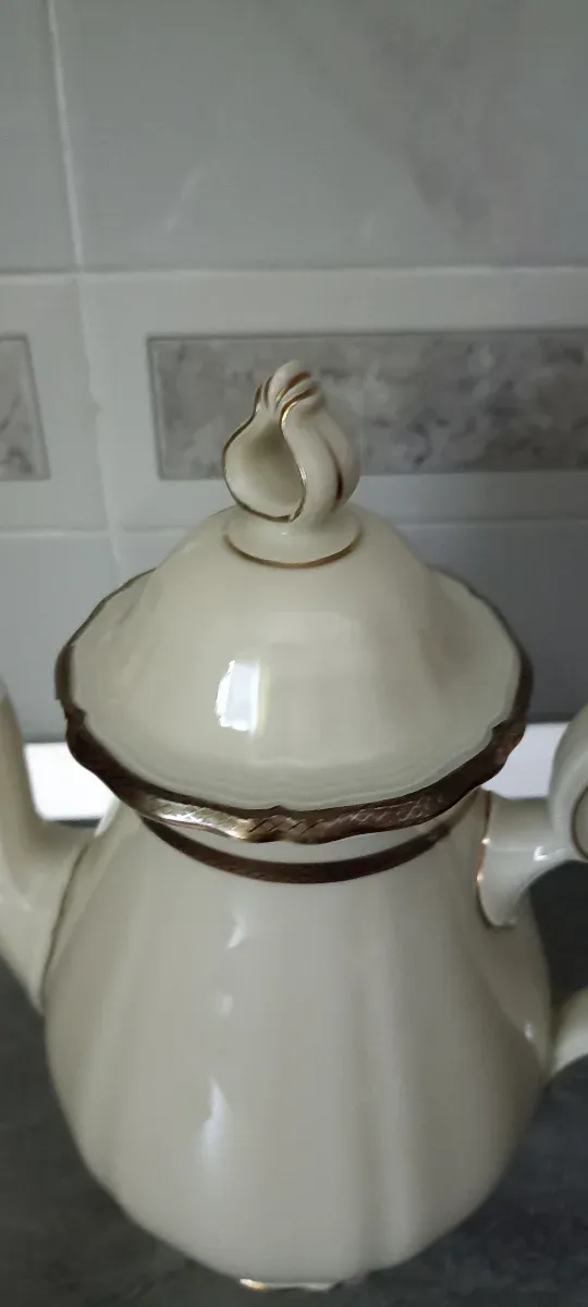 Taza de café con platillo y cuchara