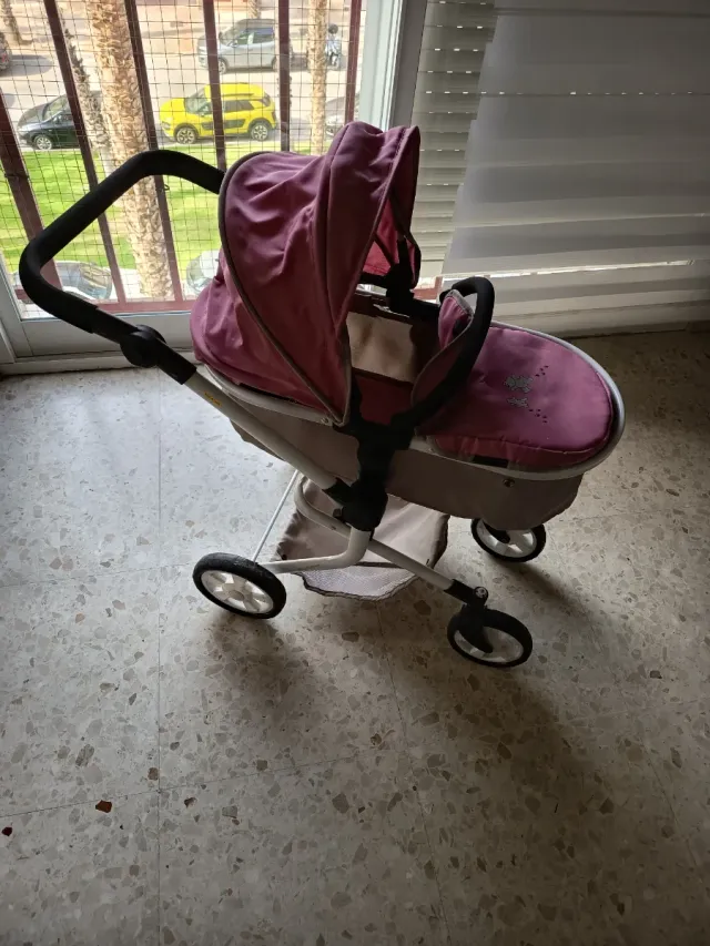 Carrito de muñecas rosa