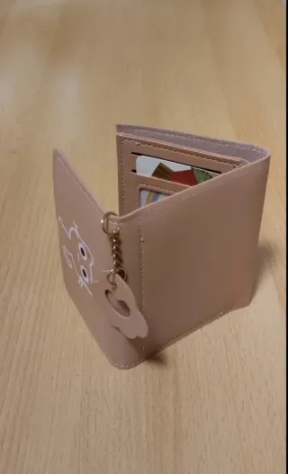 Monedero rosa con dibujo de gato