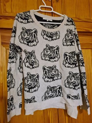 Jerseis con leones estampados en beige y negro